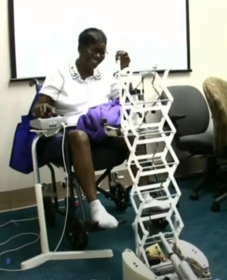 A person retrieves an object using the robot Dusty.