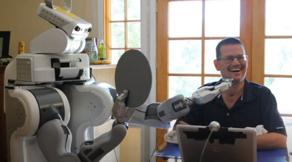 Henry Evans shaves himself using a PR2 robot.
